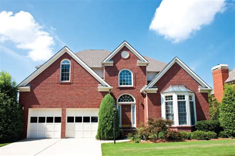 red brick house with light gray metal roof|roof colors for brick house.